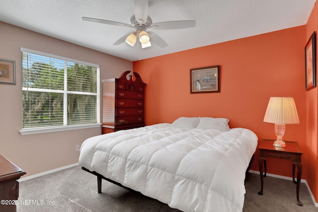 11 Arbor Club Dr Unit 212, Ponte Vedra Beach, FL 32082 - carpeted bedroom featuring a textured ceiling, baseboards, and a ceiling fan