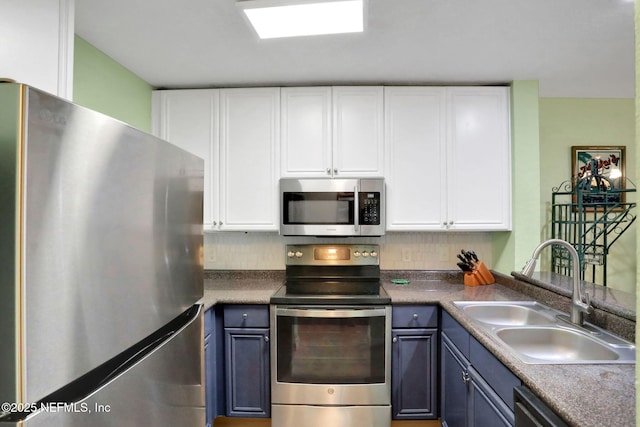 11 Arbor Club Dr Unit 212, Ponte Vedra Beach, FL 32082 - kitchen with a sink, white cabinetry, and stainless steel appliances