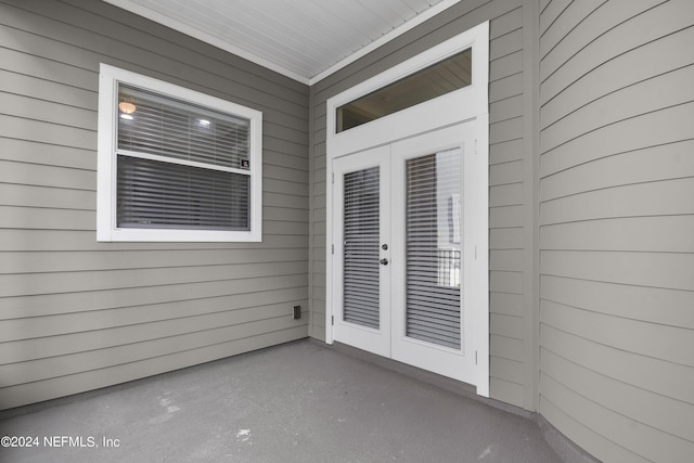 entrance to property featuring a patio and french doors