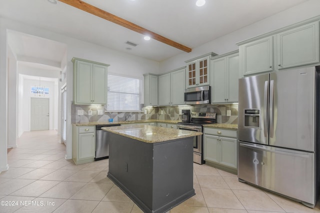kitchen with light tile patterned flooring, visible vents, beamed ceiling, appliances with stainless steel finishes, and backsplash