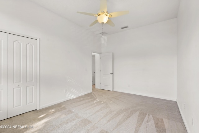 unfurnished bedroom featuring baseboards, visible vents, and carpet flooring