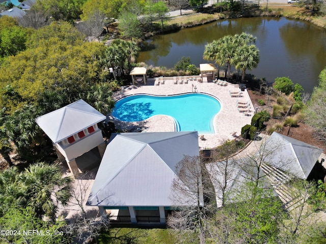 pool with a water view, a gazebo, and a patio area