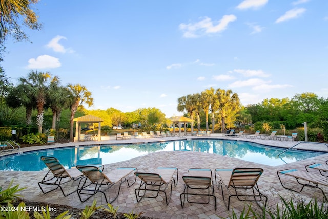 community pool featuring a gazebo and a patio area