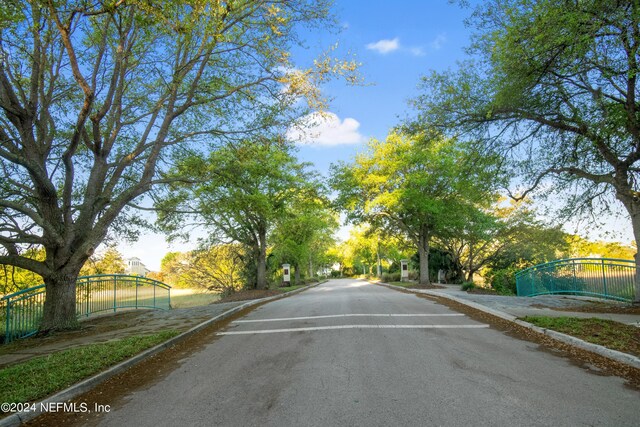 view of street with sidewalks and curbs