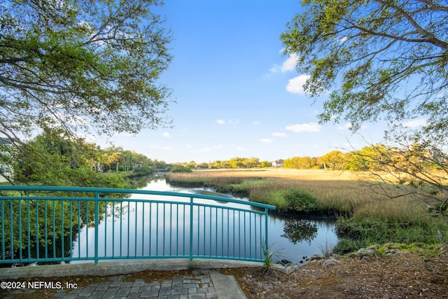 view of pool featuring a water view