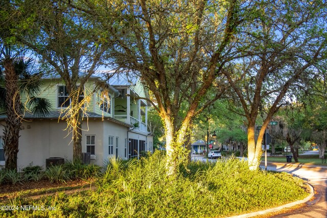 view of property exterior featuring stucco siding and central air condition unit