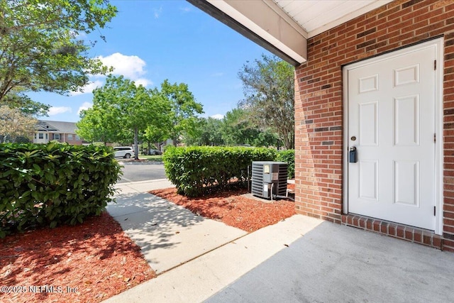 1492 Fieldview Dr, Jacksonville, FL 32225 - property entrance with brick siding and central air condition unit