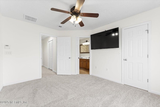 1492 Fieldview Dr, Jacksonville, FL 32225 - unfurnished bedroom with baseboards, ensuite bathroom, visible vents, and light carpet