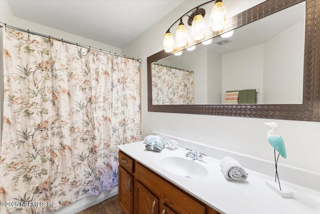1492 Fieldview Dr, Jacksonville, FL 32225 - full bath with curtained shower, a textured ceiling, visible vents, and vanity