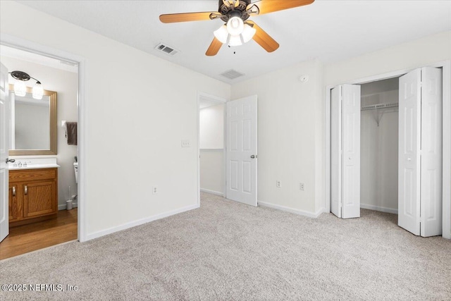 1492 Fieldview Dr, Jacksonville, FL 32225 - unfurnished bedroom with a closet, light carpet, ensuite bathroom, baseboards, and visible vents