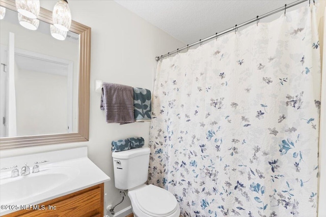 1492 Fieldview Dr, Jacksonville, FL 32225 - bathroom with a shower with curtain, toilet, vanity, and a textured ceiling