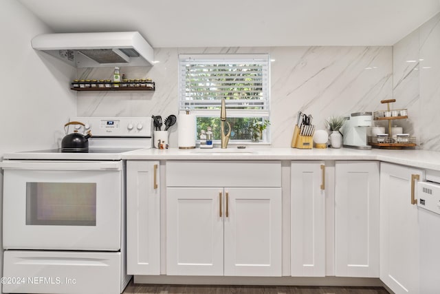 kitchen with white cabinetry, tasteful backsplash, electric range, a sink, and wall chimney exhaust hood