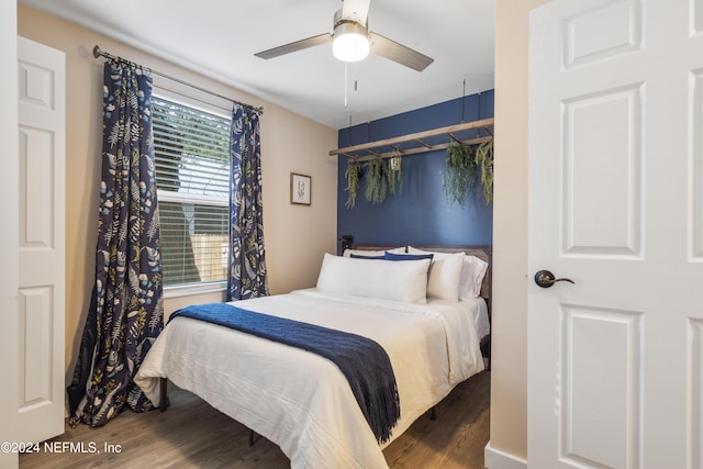 bedroom with wood finished floors and ceiling fan
