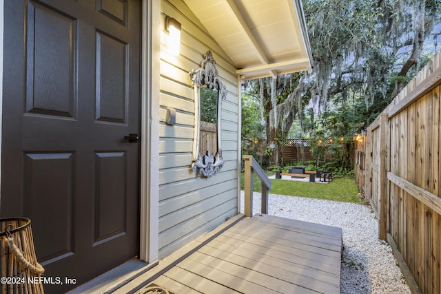 wooden deck featuring a fenced backyard