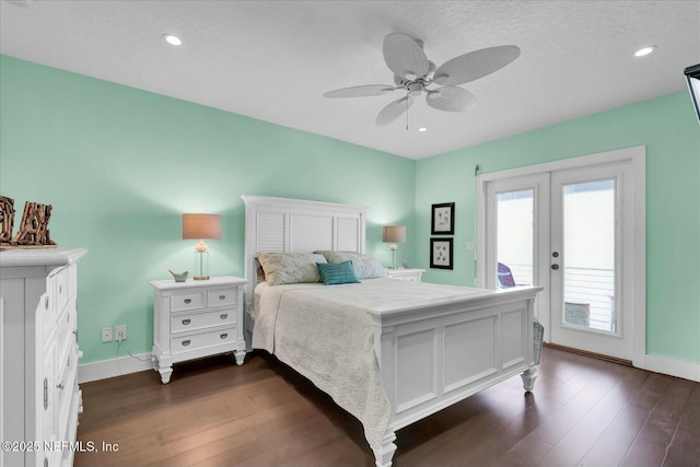 bedroom featuring access to exterior, a ceiling fan, french doors, and dark wood-type flooring