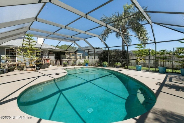 view of pool featuring fence, a lanai, a patio, and a fenced in pool