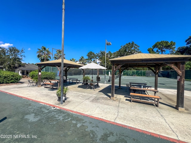 view of home's community with a gazebo and fence