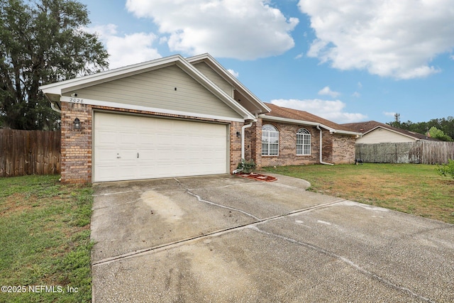 ranch-style home with brick siding, an attached garage, and concrete driveway