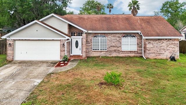 view of front of property with brick siding, driveway, an attached garage, and a front lawn