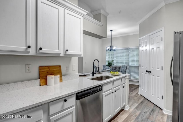 7800 Point Meadows Dr Unit 1511, Jacksonville, FL 32256 - kitchen with ornamental molding, a chandelier, a sink, white cabinets, and appliances with stainless steel finishes
