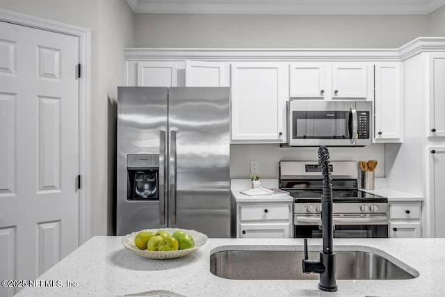 7800 Point Meadows Dr Unit 1511, Jacksonville, FL 32256 - kitchen with white cabinetry, appliances with stainless steel finishes, and crown molding