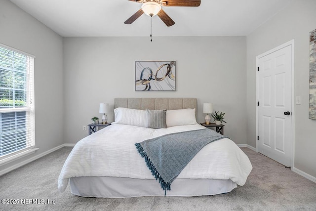 7800 Point Meadows Dr Unit 1511, Jacksonville, FL 32256 - carpeted bedroom featuring baseboards and ceiling fan