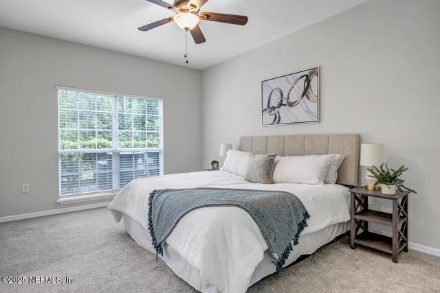 7800 Point Meadows Dr Unit 1511, Jacksonville, FL 32256 - bedroom featuring baseboards, carpet flooring, and a ceiling fan