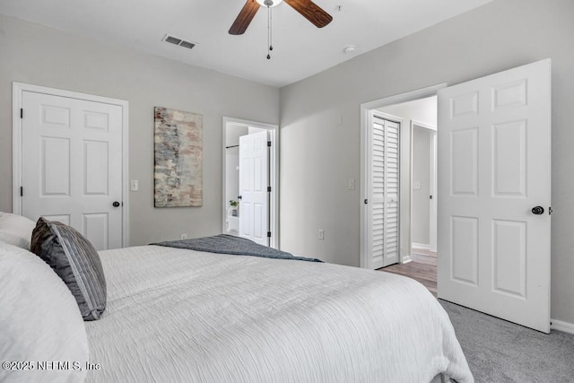 7800 Point Meadows Dr Unit 1511, Jacksonville, FL 32256 - bedroom with carpet floors, a ceiling fan, ensuite bathroom, baseboards, and visible vents