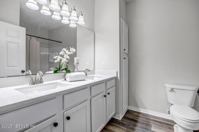 7800 Point Meadows Dr Unit 1511, Jacksonville, FL 32256 - bathroom with double vanity, wood finished floors, toilet, and a sink