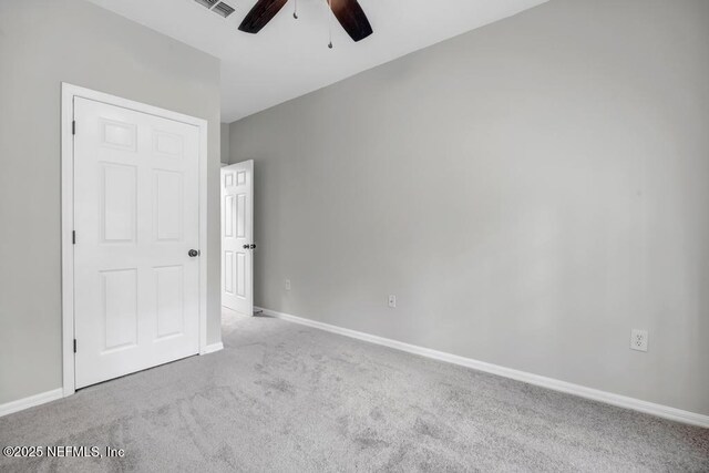 7800 Point Meadows Dr Unit 1511, Jacksonville, FL 32256 - unfurnished bedroom with carpet flooring, a ceiling fan, baseboards, and visible vents