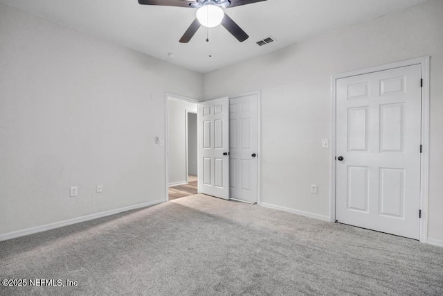 7800 Point Meadows Dr Unit 1511, Jacksonville, FL 32256 - unfurnished bedroom with baseboards, carpet flooring, visible vents, and a ceiling fan