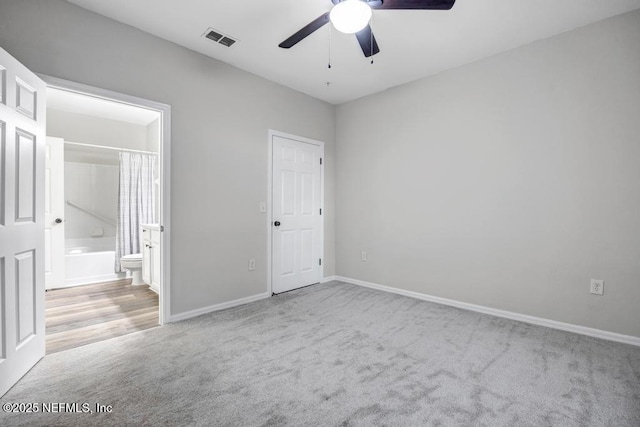 7800 Point Meadows Dr Unit 1511, Jacksonville, FL 32256 - unfurnished bedroom featuring carpet flooring, a ceiling fan, ensuite bathroom, baseboards, and visible vents