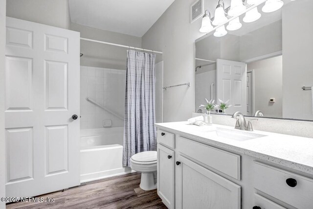 7800 Point Meadows Dr Unit 1511, Jacksonville, FL 32256 - bathroom with shower / bath combo, visible vents, toilet, wood finished floors, and vanity