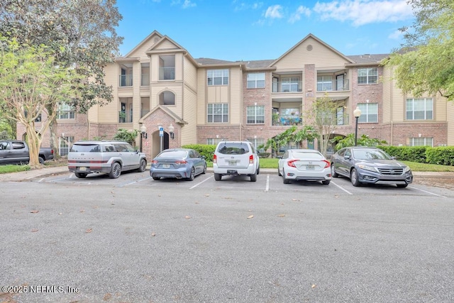7800 Point Meadows Dr Unit 1511, Jacksonville, FL 32256 - view of building exterior featuring uncovered parking