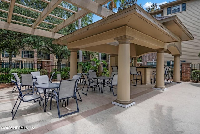 7800 Point Meadows Dr Unit 1511, Jacksonville, FL 32256 - view of patio with fence, outdoor dry bar, outdoor dining space, and a pergola
