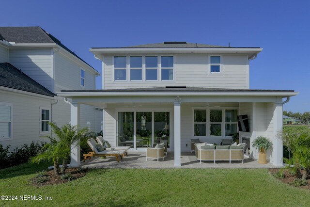 928 Caiden Dr, Ponte Vedra, FL 32081 - back of house with an outdoor living space, a lawn, and a patio area