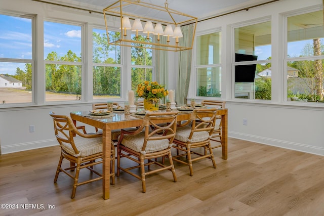 928 Caiden Dr, Ponte Vedra, FL 32081 - dining room featuring baseboards, plenty of natural light, light wood-style floors, and a chandelier