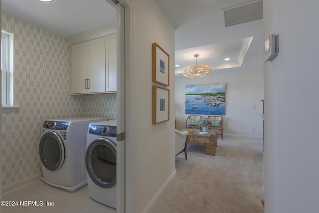 928 Caiden Dr, Ponte Vedra, FL 32081 - washroom featuring washing machine and clothes dryer, cabinet space, wallpapered walls, a chandelier, and baseboards