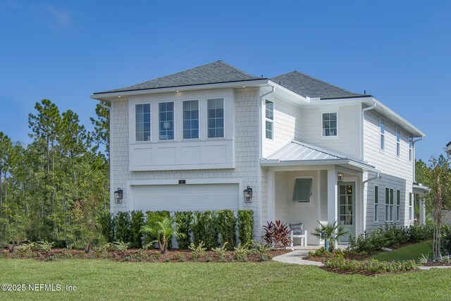 928 Caiden Dr, Ponte Vedra, FL 32081 - view of front of home featuring an attached garage, a front lawn, a standing seam roof, roof with shingles, and metal roof