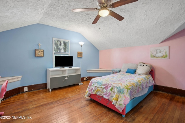 2541 Grand St, Jacksonville, FL 32208 - bedroom featuring baseboards, wood-type flooring, a textured ceiling, and vaulted ceiling