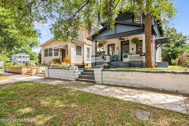 view of front facade with a porch and ceiling fan
