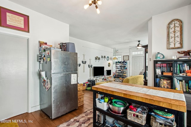 kitchen featuring freestanding refrigerator, wood finished floors, and a ceiling fan