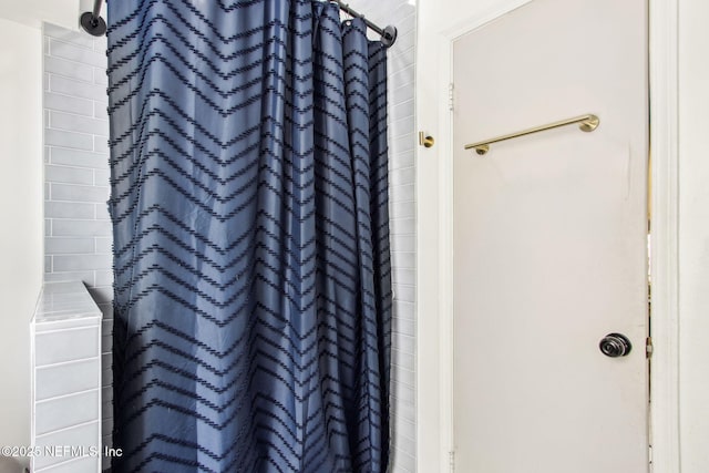 bathroom with a shower with curtain