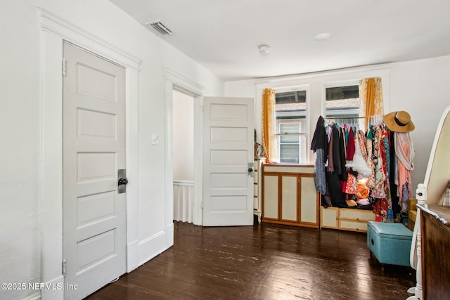 foyer featuring visible vents and hardwood / wood-style flooring