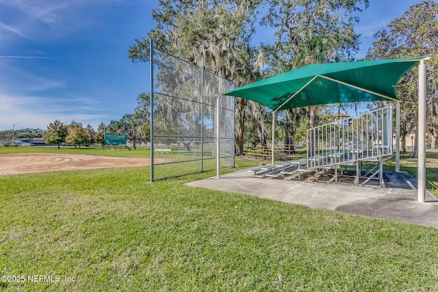 view of property's community with a lawn