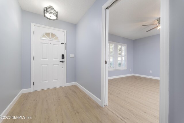 476 Monet Ave, Ponte Vedra, FL 32081 - entryway with baseboards, light wood-style flooring, and ceiling fan