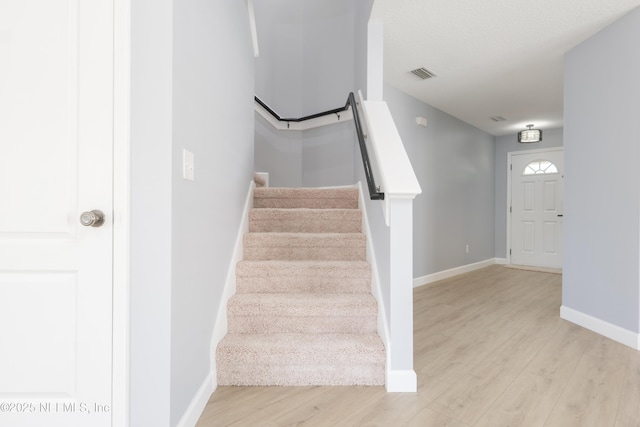 476 Monet Ave, Ponte Vedra, FL 32081 - stairway featuring baseboards, visible vents, and wood finished floors