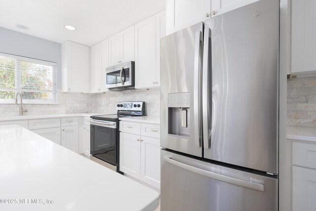 476 Monet Ave, Ponte Vedra, FL 32081 - kitchen featuring light countertops, a sink, tasteful backsplash, and appliances with stainless steel finishes