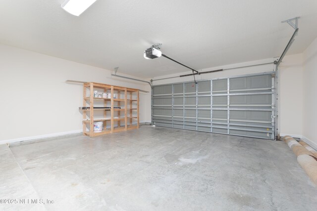 476 Monet Ave, Ponte Vedra, FL 32081 - garage with baseboards and a garage door opener