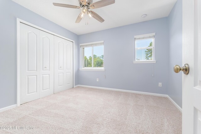 476 Monet Ave, Ponte Vedra, FL 32081 - unfurnished bedroom featuring a closet, carpet flooring, baseboards, and a ceiling fan